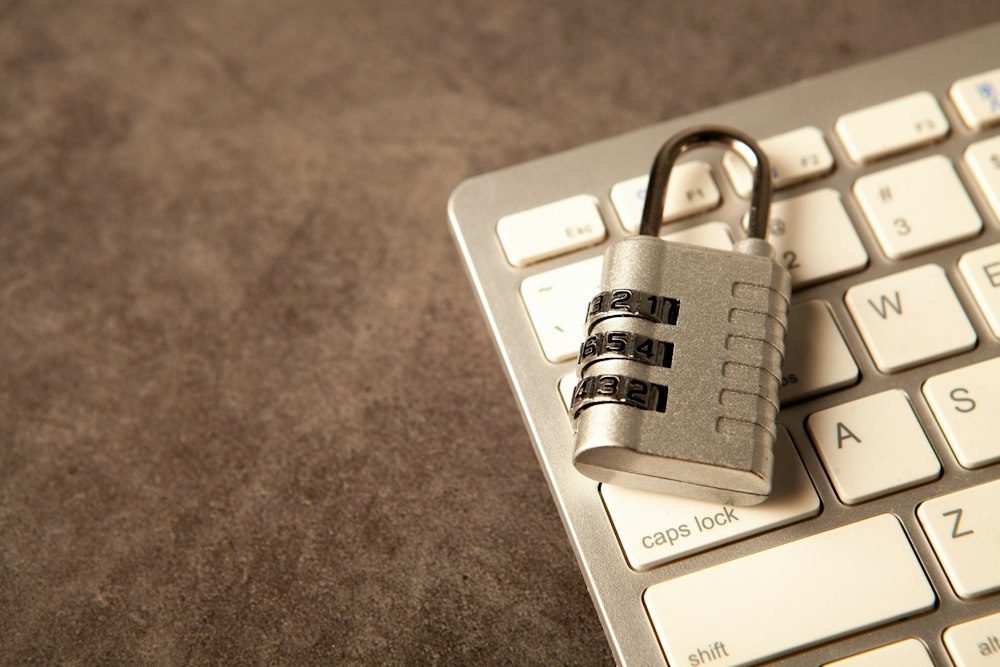 A combination padlock on a computer keyboard