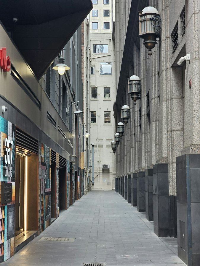 Narrow commercial laneway between buildings off Collins Street in Melbourne, Australia