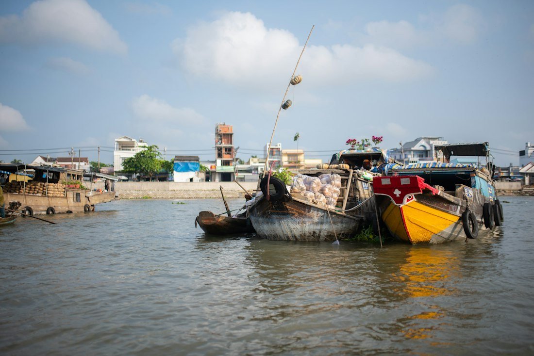 Working boats on a Mekong waterway in Vietnam