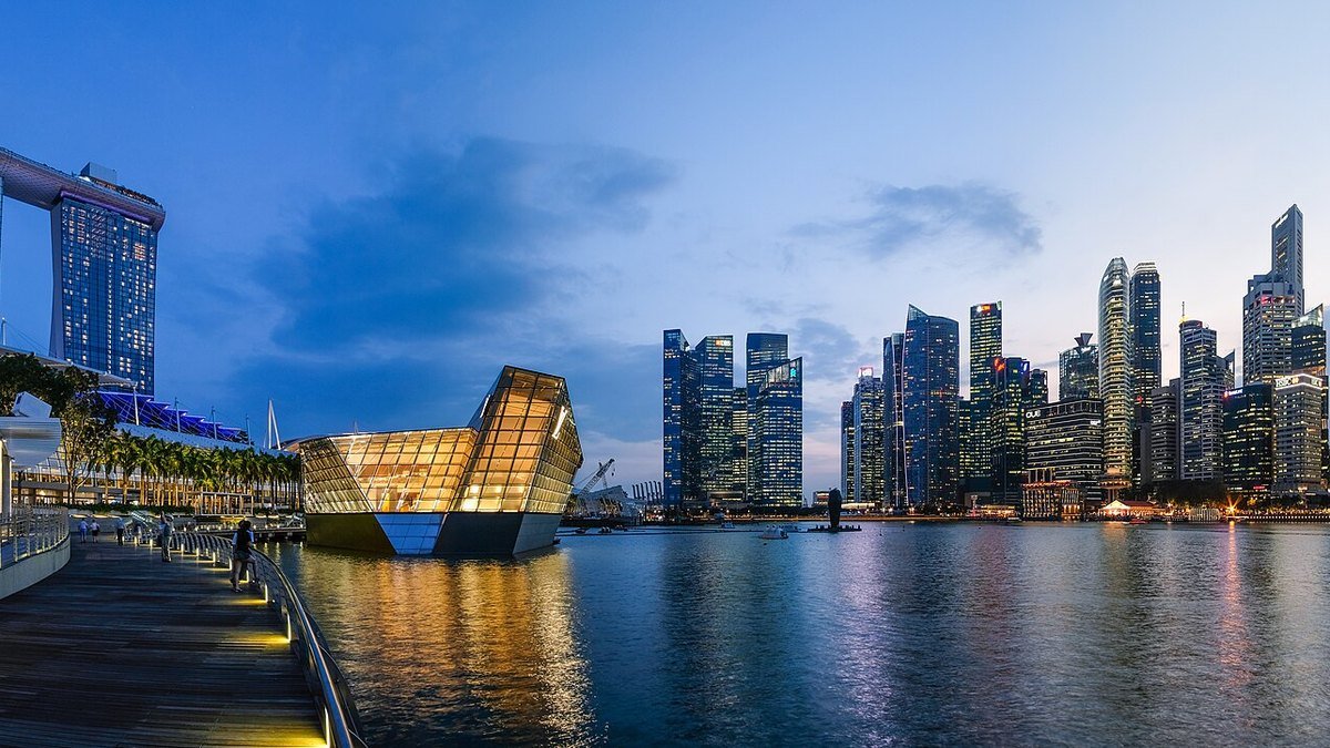 Singapore's Marina Bay skyline illuminated at night, symbolising the financial centre amid global economic uncertainty