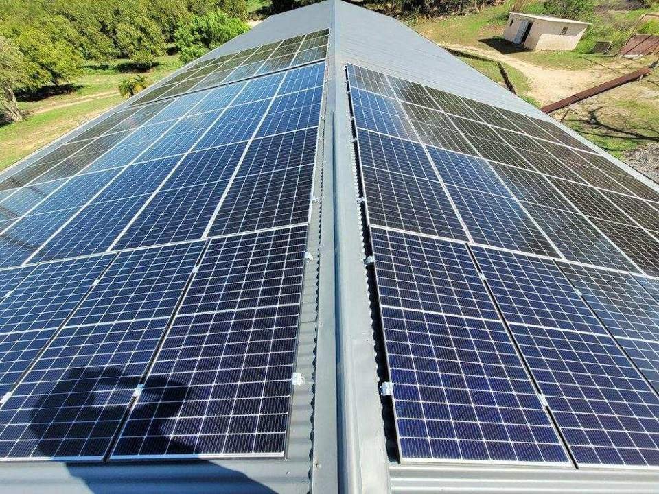 Solar photovoltaic panels on a corrugated metal roof