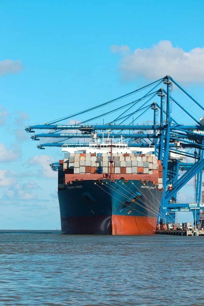 Container vessel and gantry cranes at Hai Phong International Container Terminal, Vietnam